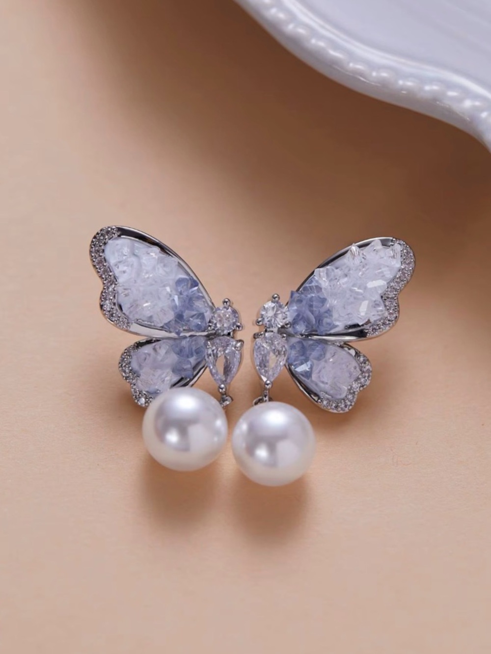 Silver Butterfly Pearl Drop Earrings with Pale Blue Crystal Wings